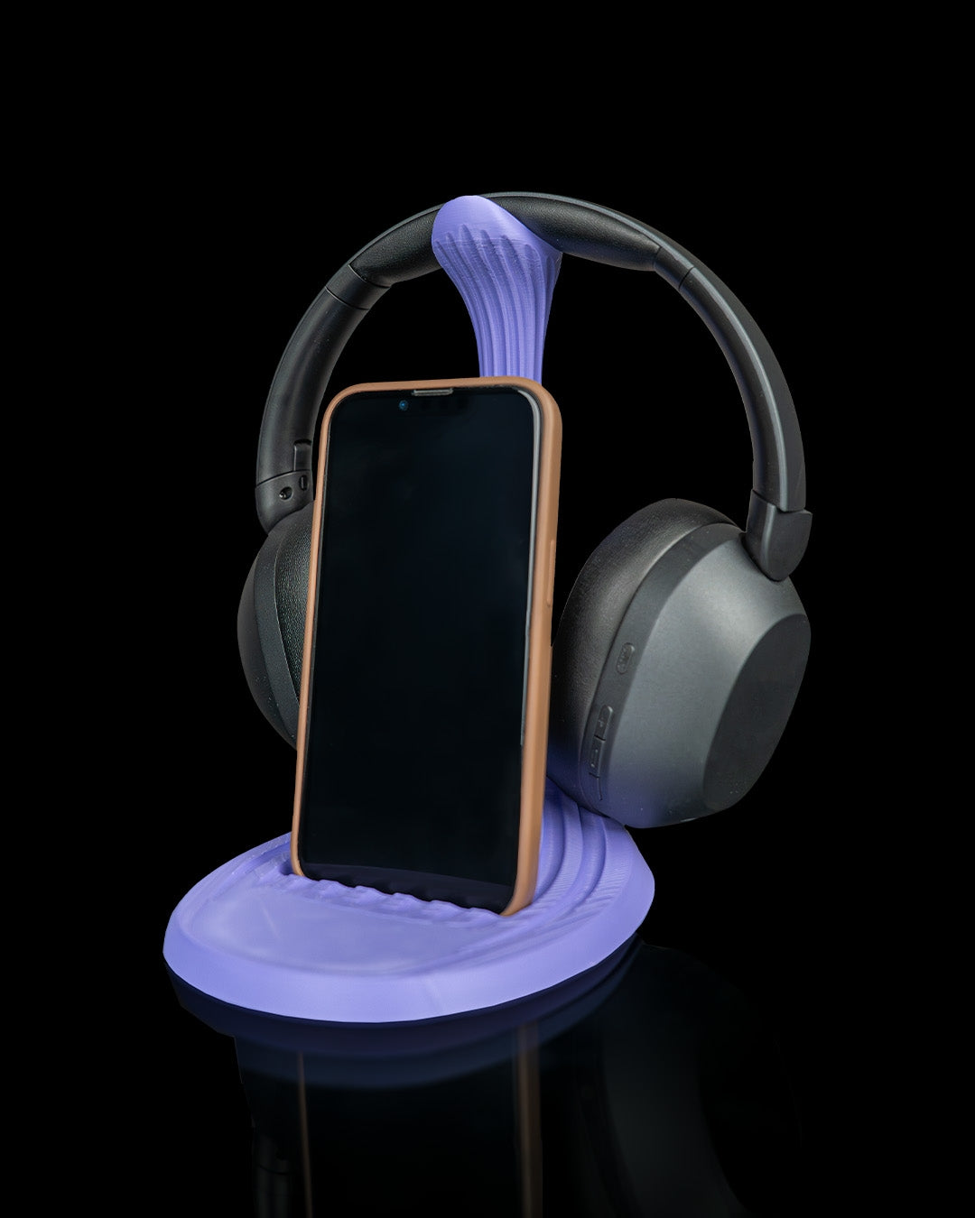 Flow Stand — a 3D-printed headphone and phone holder — shown on a desk