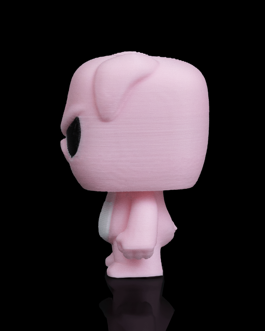 Anty Pig articulated 3D-printed collectible keyring — shown in hand for scale
