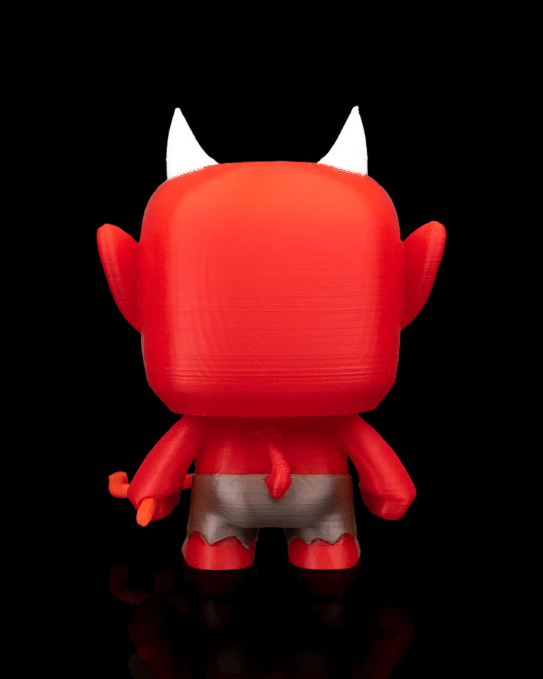 Antyferno devil Anty articulated 3D-printed Halloween keyring — shown in hand for scale