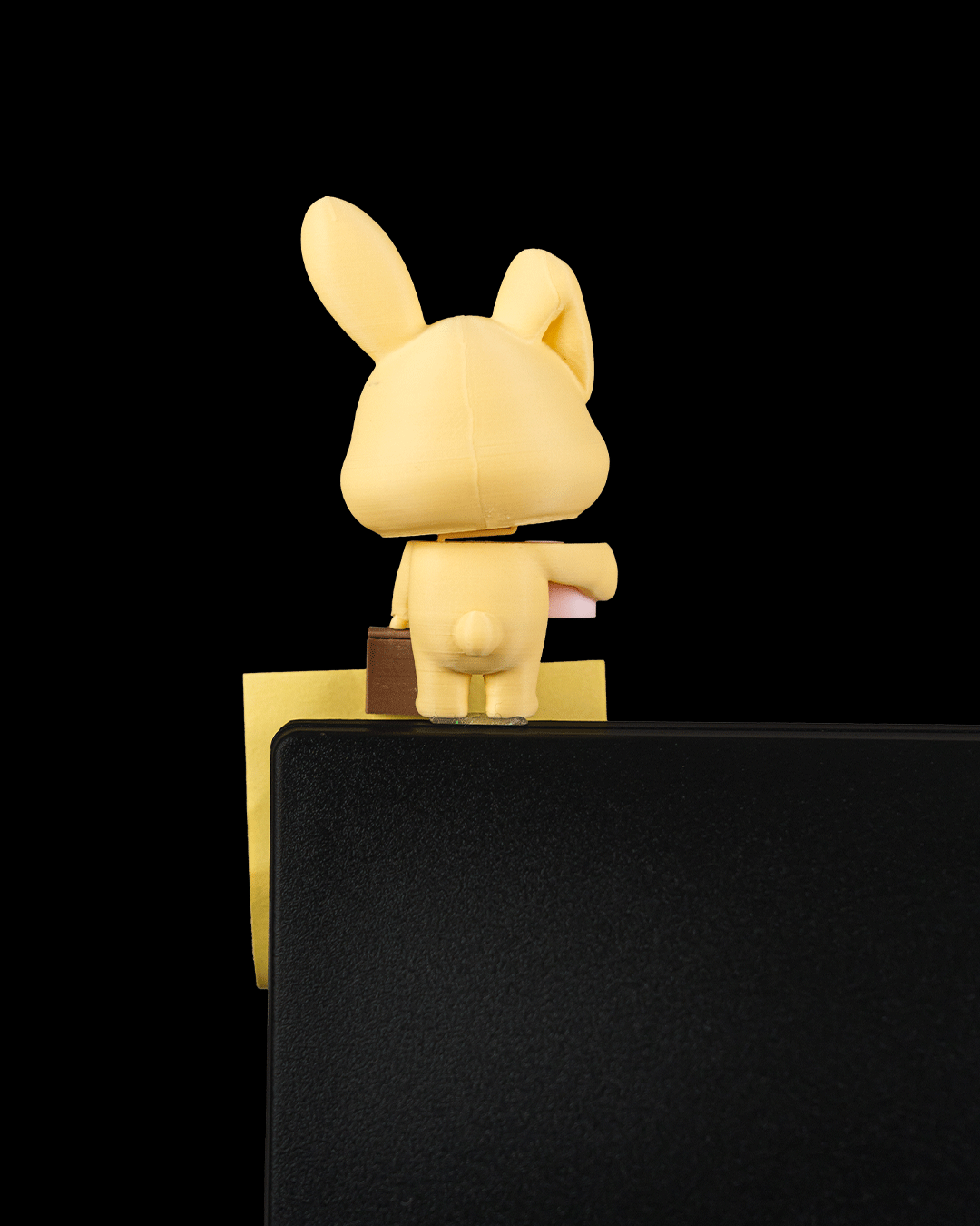Office Bunny — a 3D-printed sticky note holder — clipped to a monitor