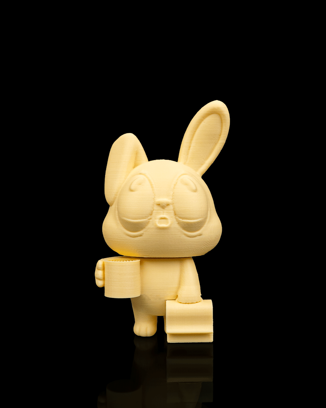 Office Bunny — a 3D-printed sticky note holder — holding notes in use