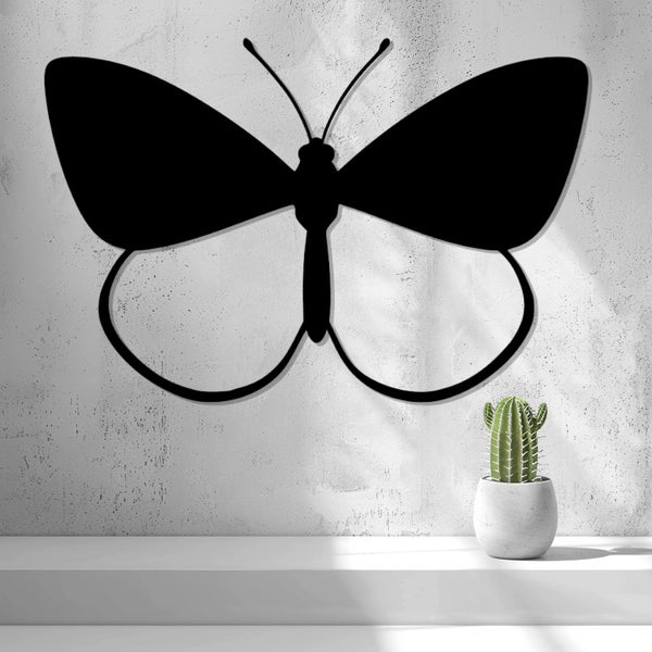 Butterfly Wall Art — shown in black on a wall