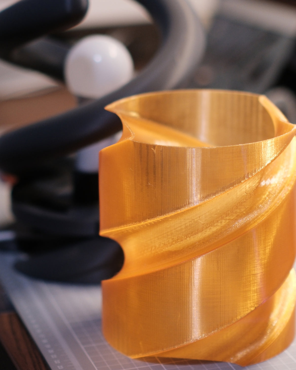 Coil Lamp — close-up of the translucent orange shade and its spiral groove