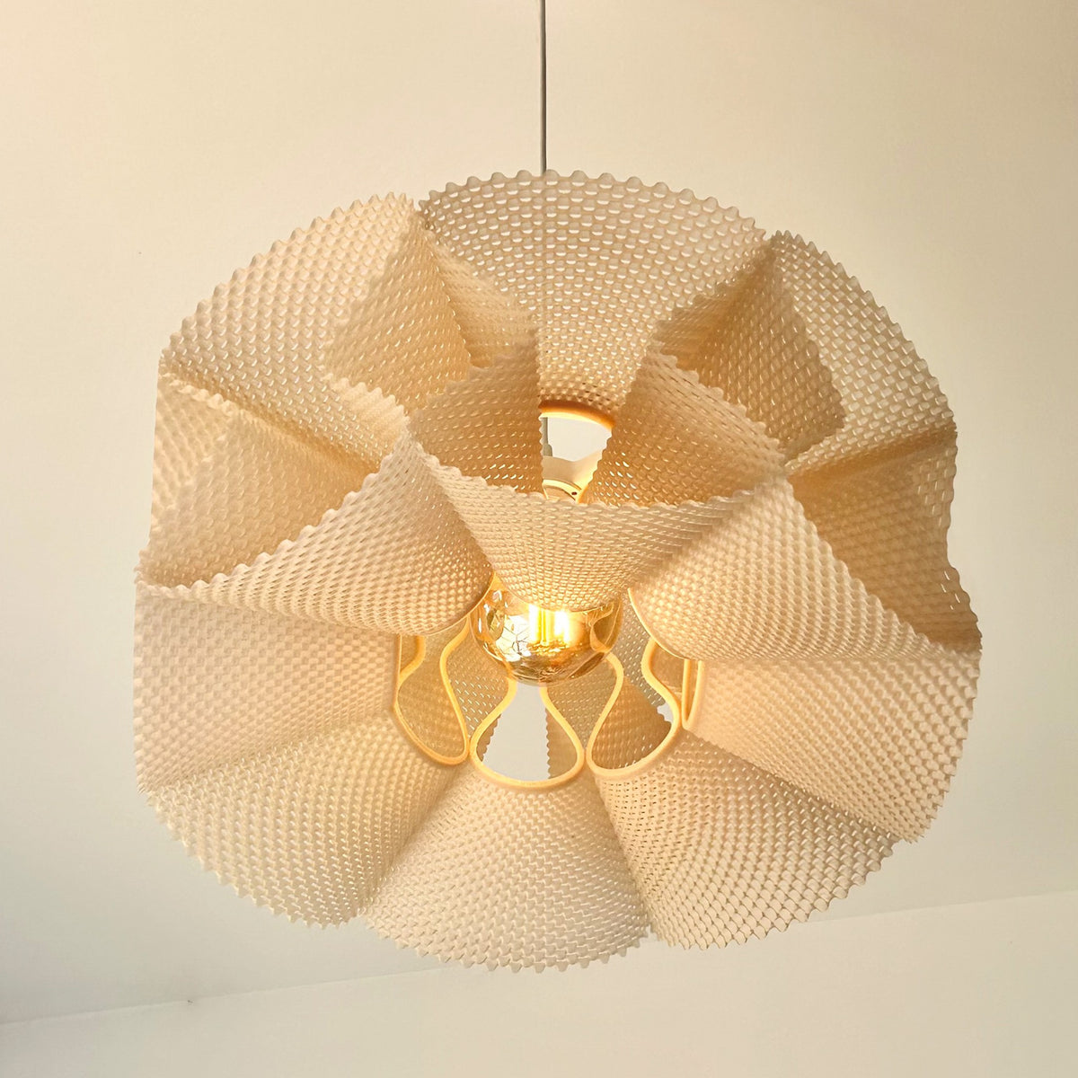 Coroa Pendant Light — three-quarter view from below showing the textured petals