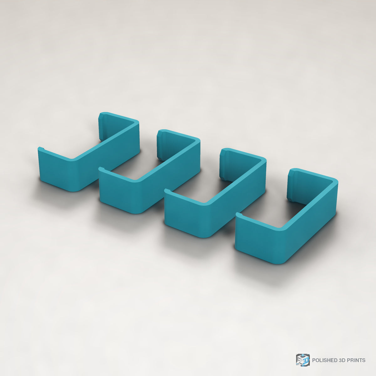 Link-A-Link Cable Management Clips – in ASA Teal on a warm studio background