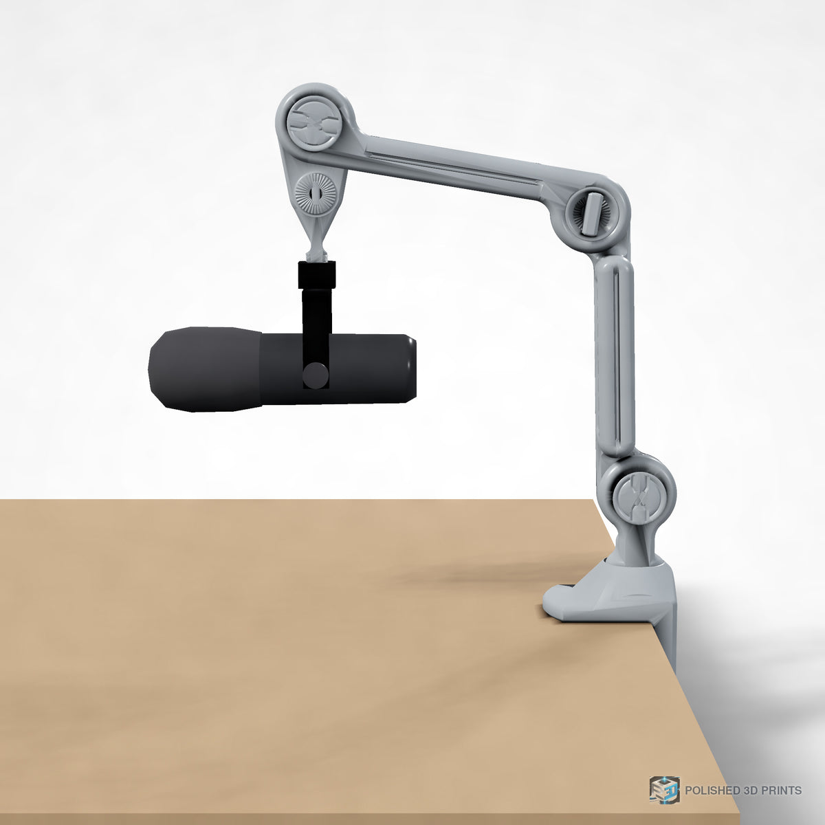 Link-A-Link Mic Arm Kit, assembled clamped to a desk holding a microphone – side profile