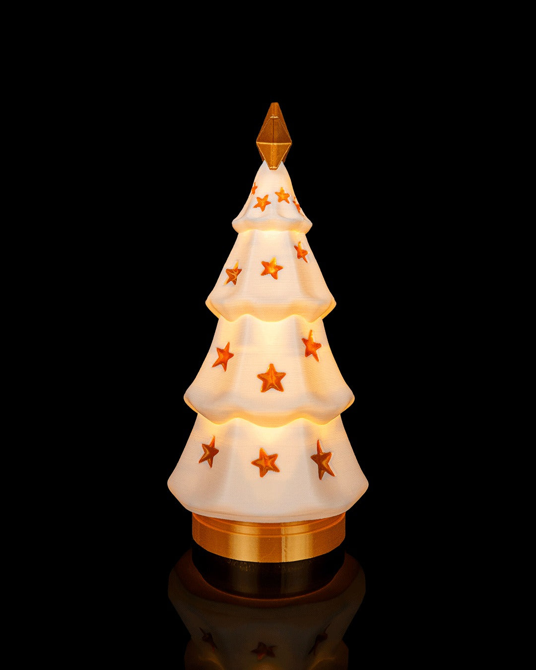 Luminous Tree Table Lamp — tiered tree glowing with a gold finial