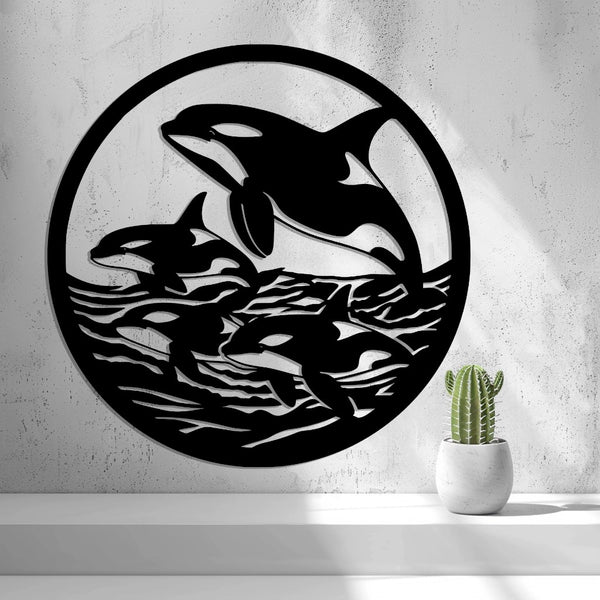 Orcas in the Ocean Wall Art — shown in black on a wall