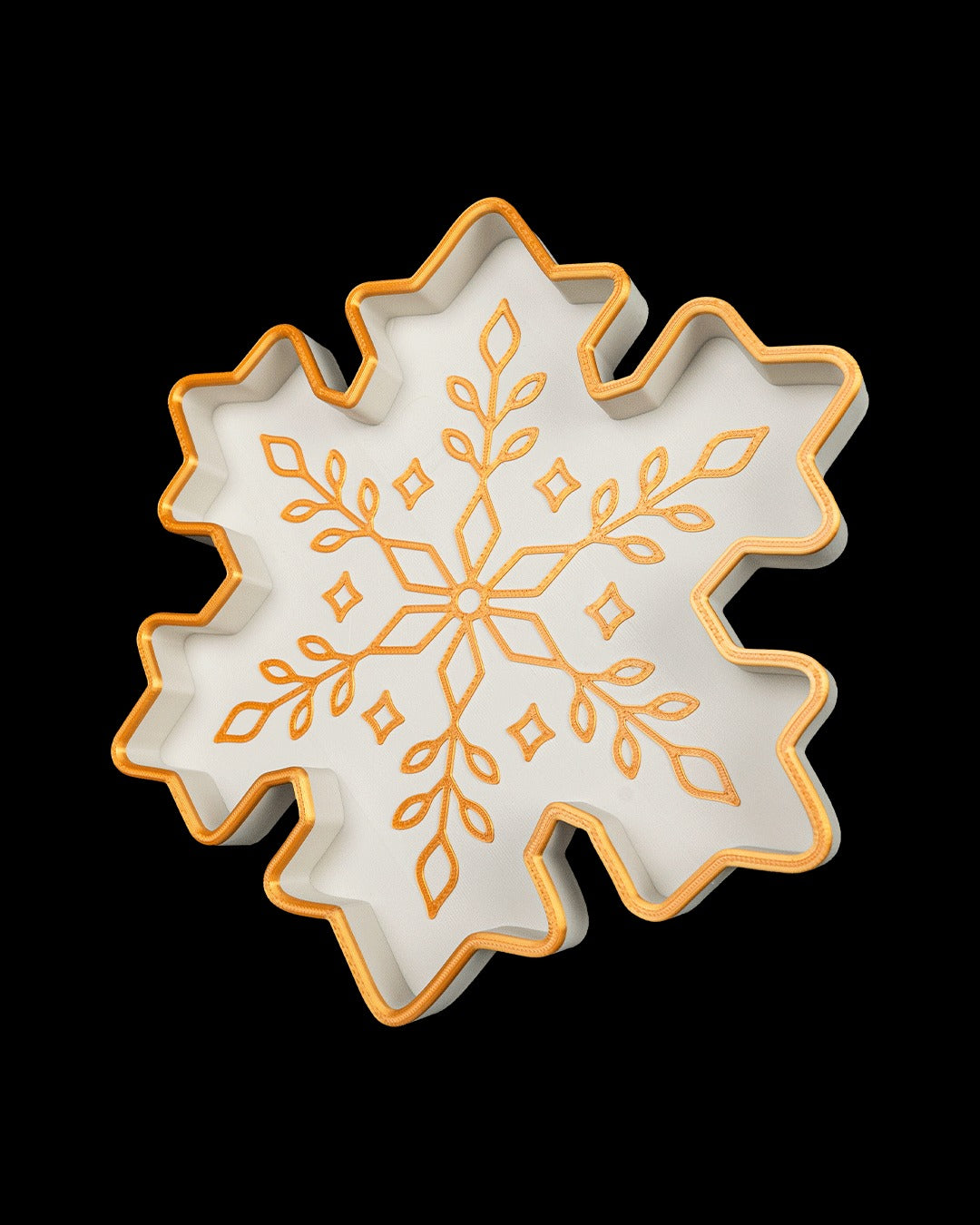 Snowflake Tray — tilted view of the gold snowflake design