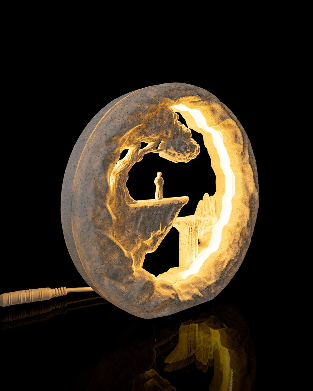The Wanderer Table Lamp — side view while lit, with the power cord
