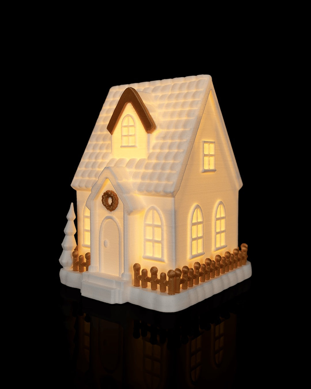 Village Lights Table Lamp — Cottage glowing, angled view