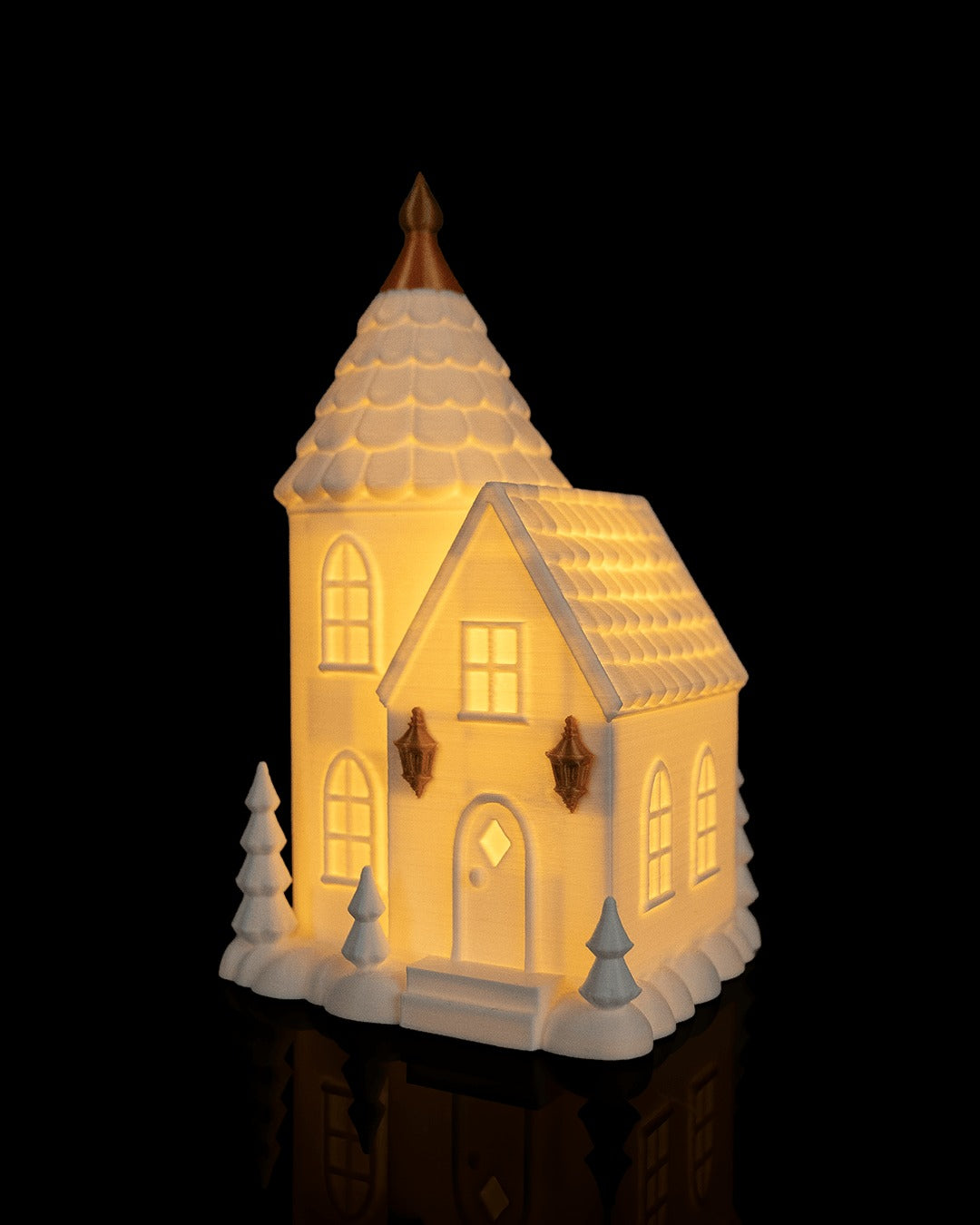 Village Lights Table Lamp — Tower House glowing, angled view