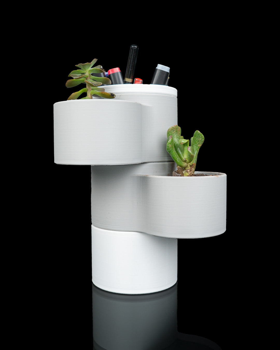 Living Stack — a 3D-printed lamp, planter and organizer — shown on a desk