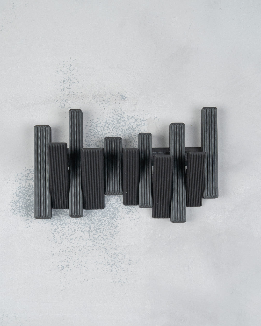 Modern Grid — a 3D-printed wall hook set — in use