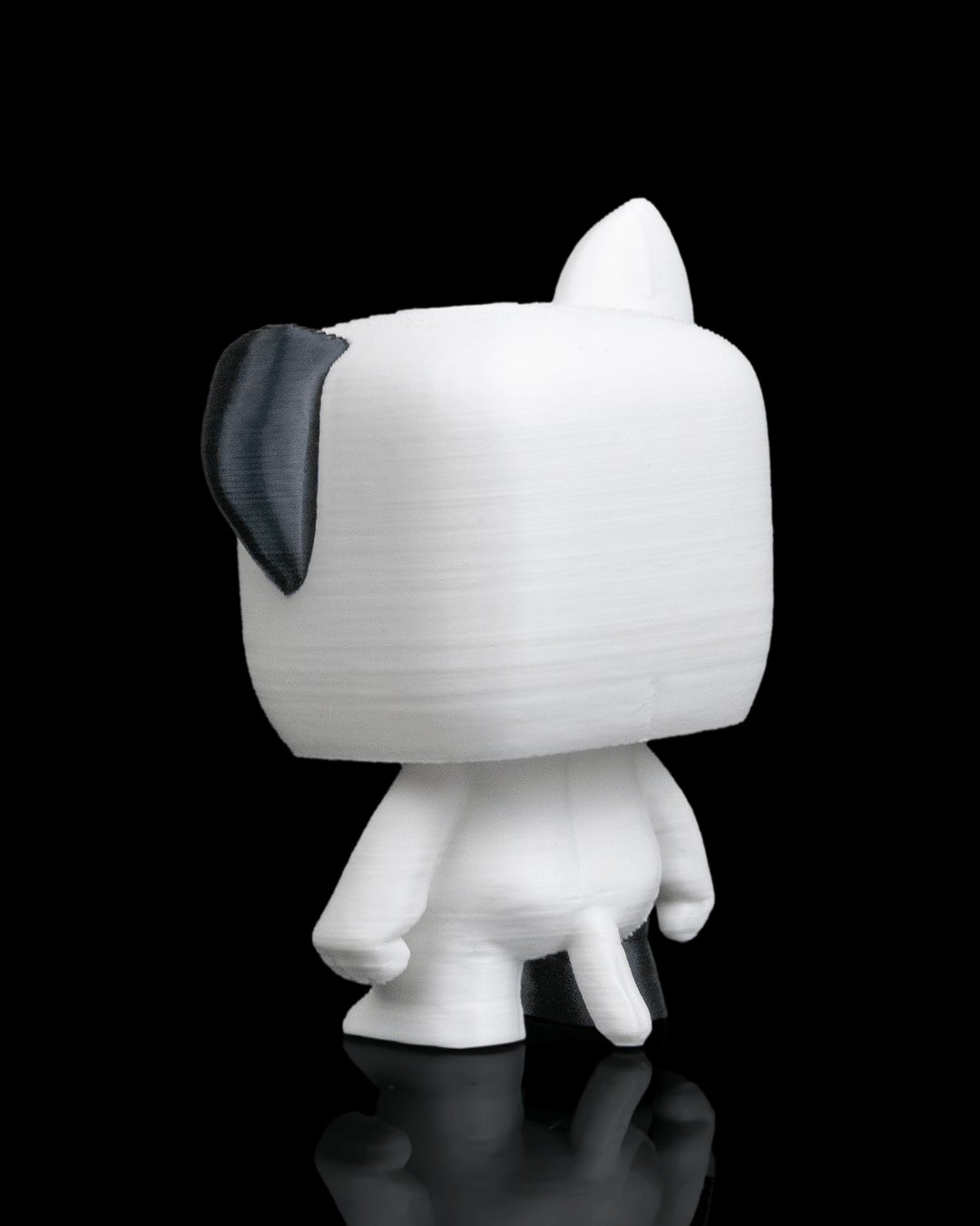 Anty Dog articulated 3D-printed collectible keyring — shown in hand for scale