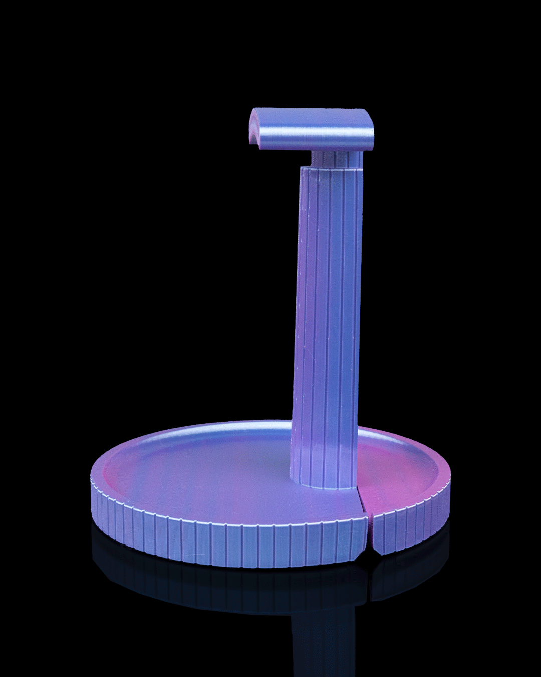 Clean — a minimalist 3D-printed headphone stand — holding headphones in use