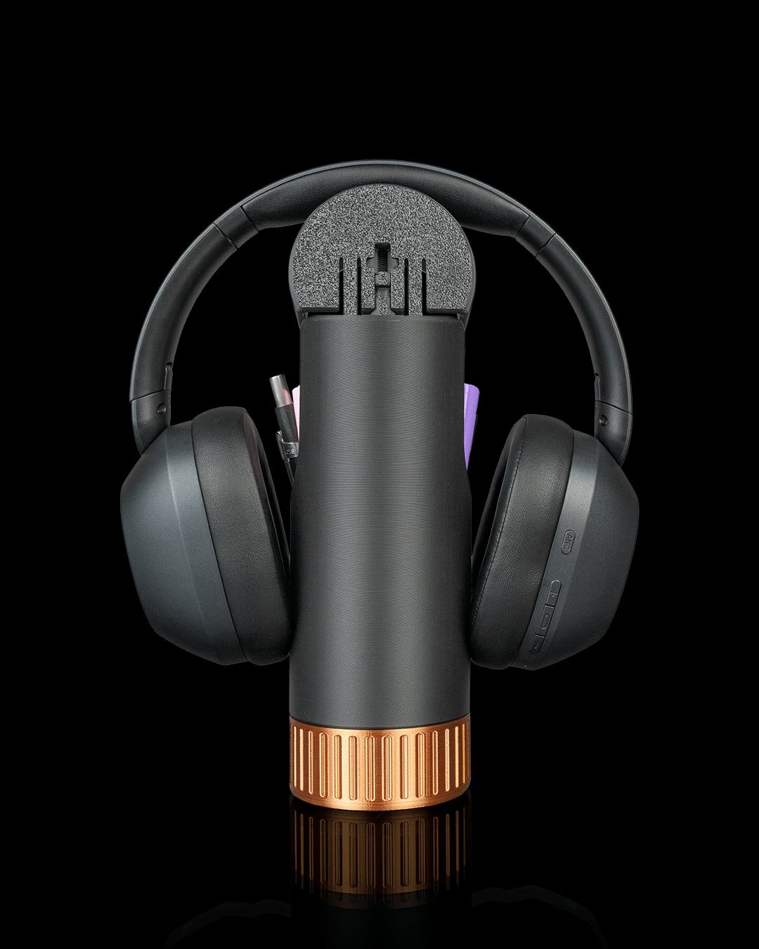 Curve Caddy — a 3D-printed headphone holder with desk catch-all — in use