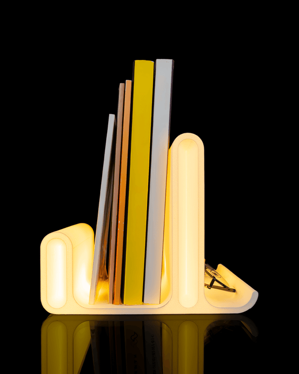 Glow Arc — a softly lit 3D-printed book and glasses holder — front view