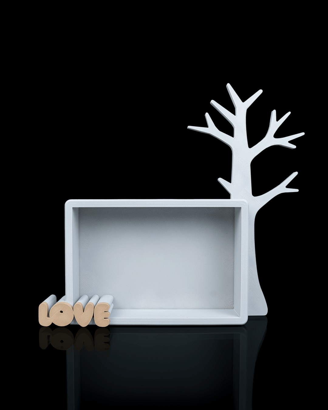 Keepsake Tree — a 3D-printed photo frame and jewelry stand — holding jewelry in use