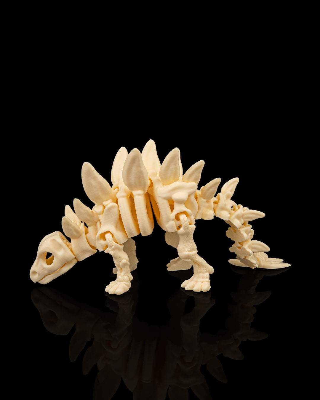 Articulated 3D-printed Stegosaurus dinosaur skeleton — poseable desk figurine (view 2)