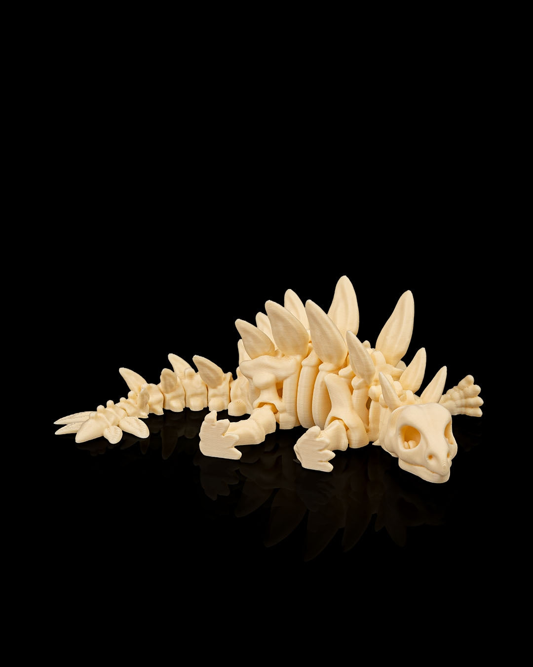 Articulated 3D-printed Stegosaurus dinosaur skeleton — poseable desk figurine (view 6)