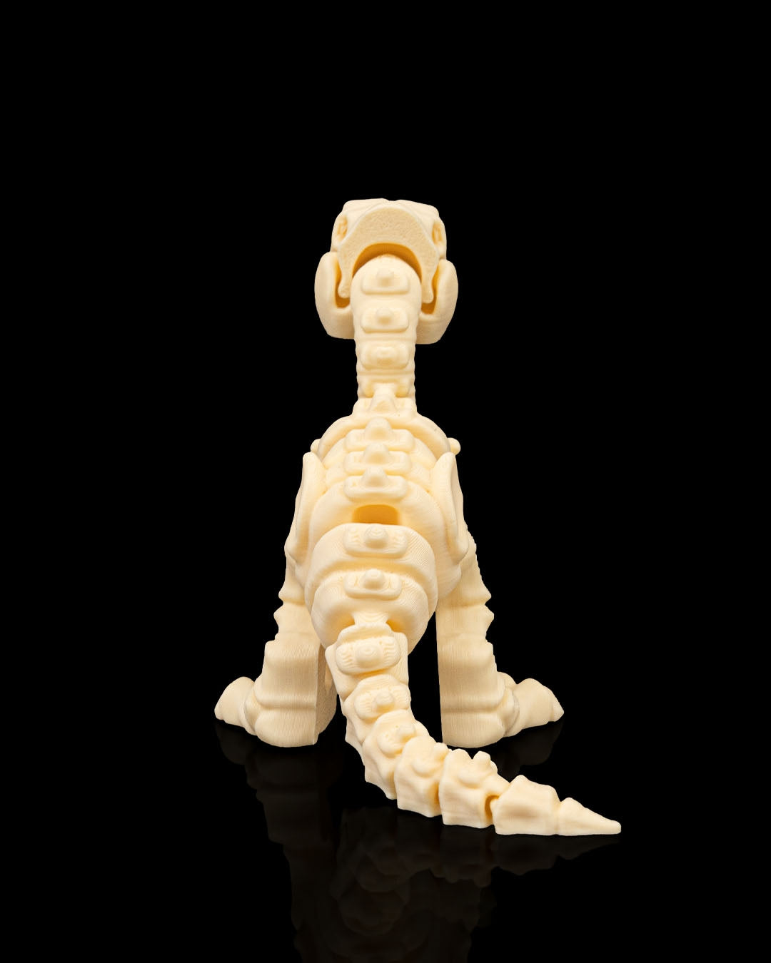 Articulated 3D-printed Velociraptor dinosaur skeleton — poseable desk figurine (view 3)