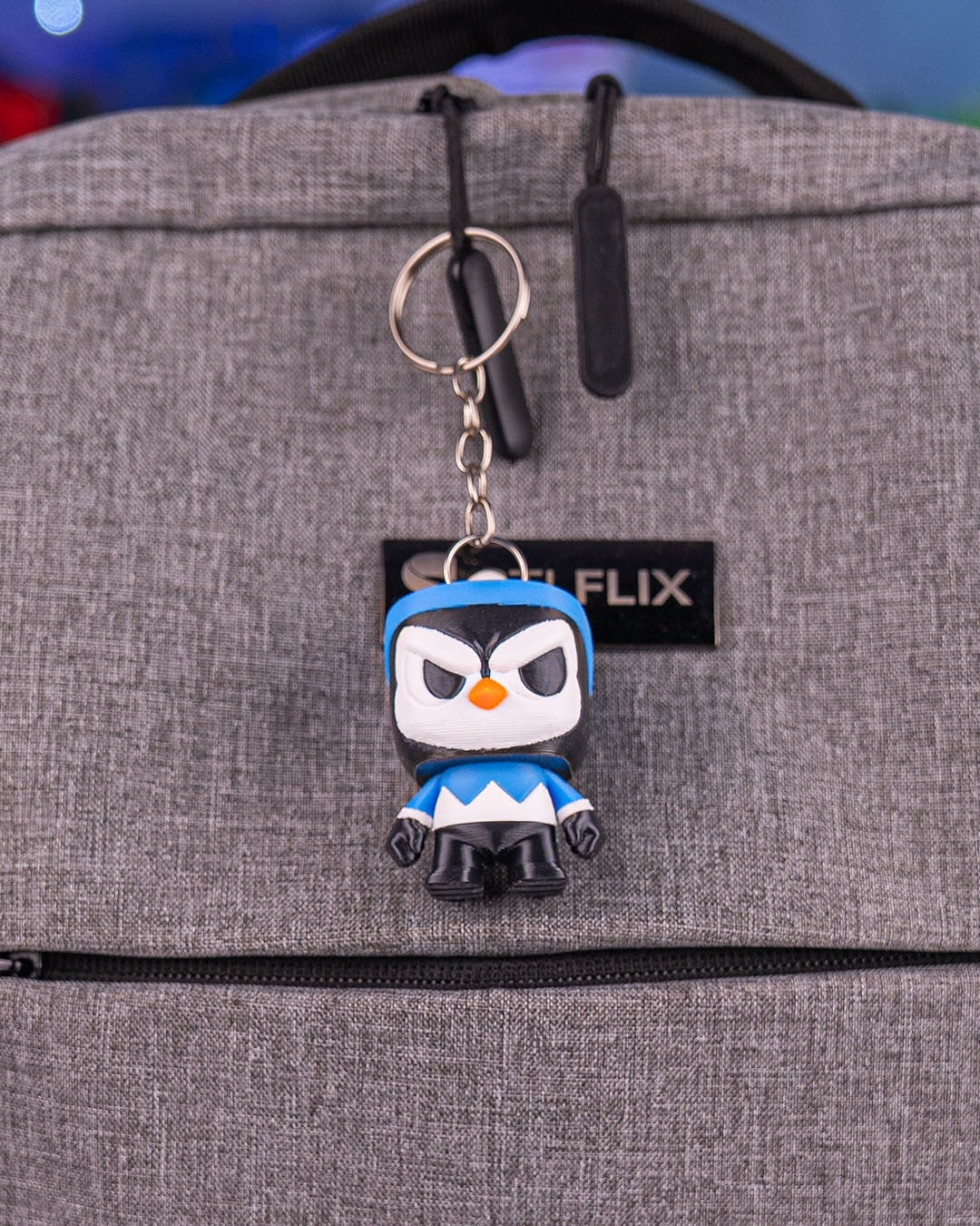 Anty Penguin 3D-printed Christmas keyring — clipped to a backpack as a keyring