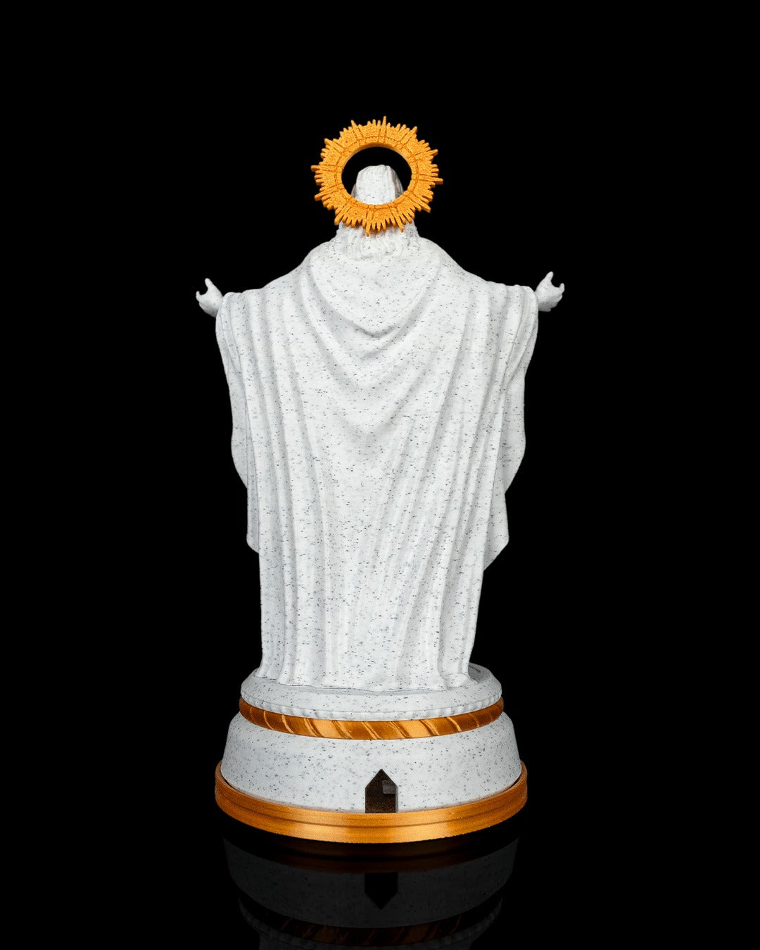 Christ of Light Statue — back view showing the cable port