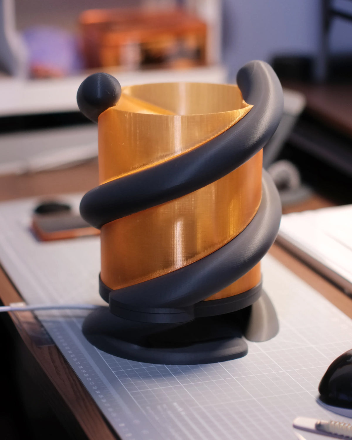 Coil Lamp — three-quarter view on a desk