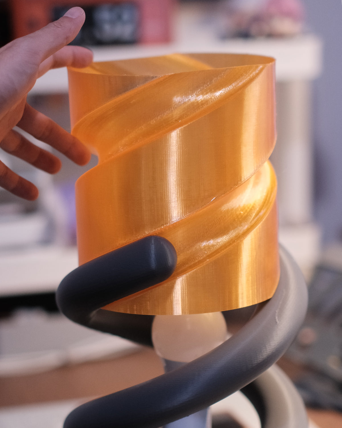 Coil Lamp — shade twisted up through the coil, bulb visible below