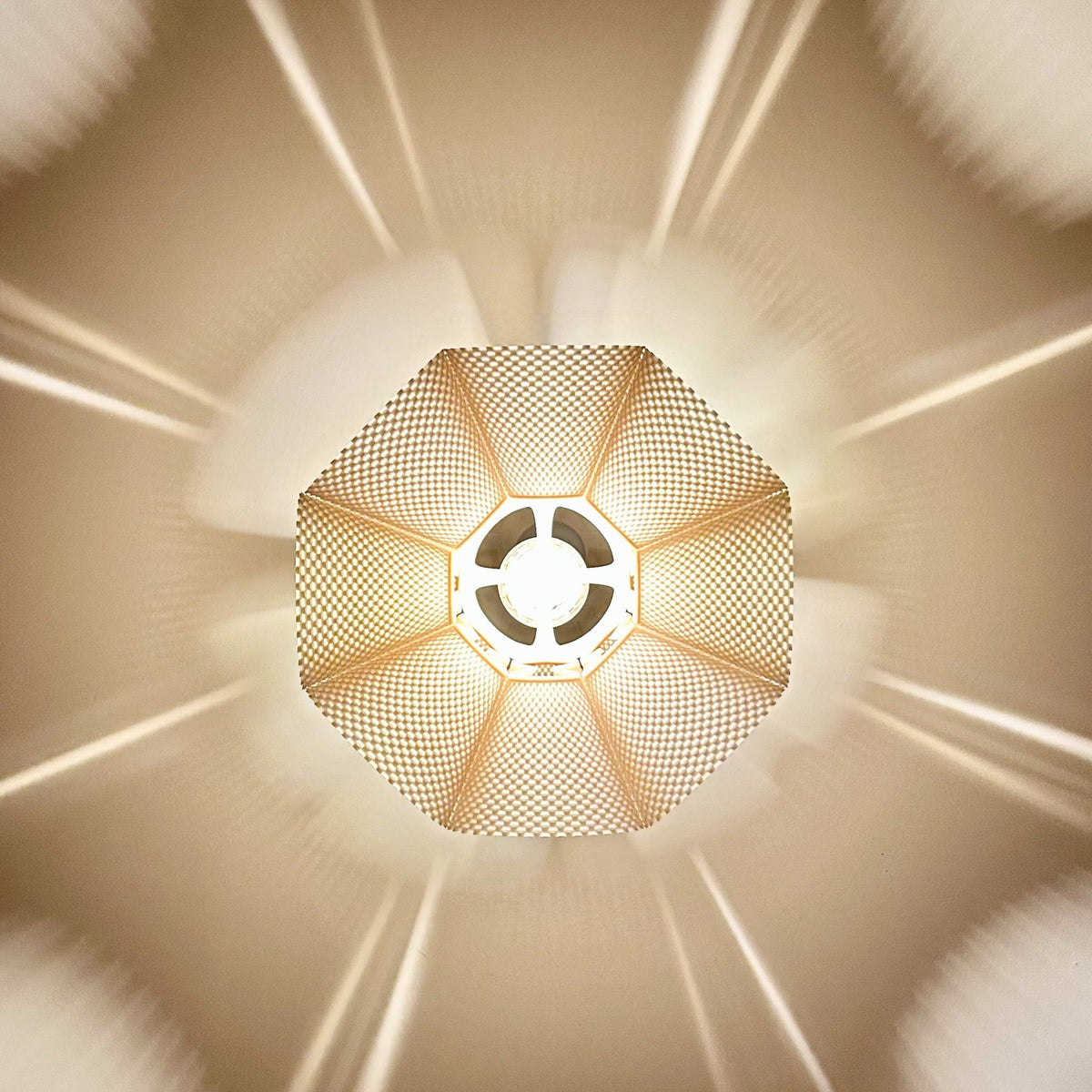 Coroa Pendant Light — star pattern of light and shadow on the ceiling