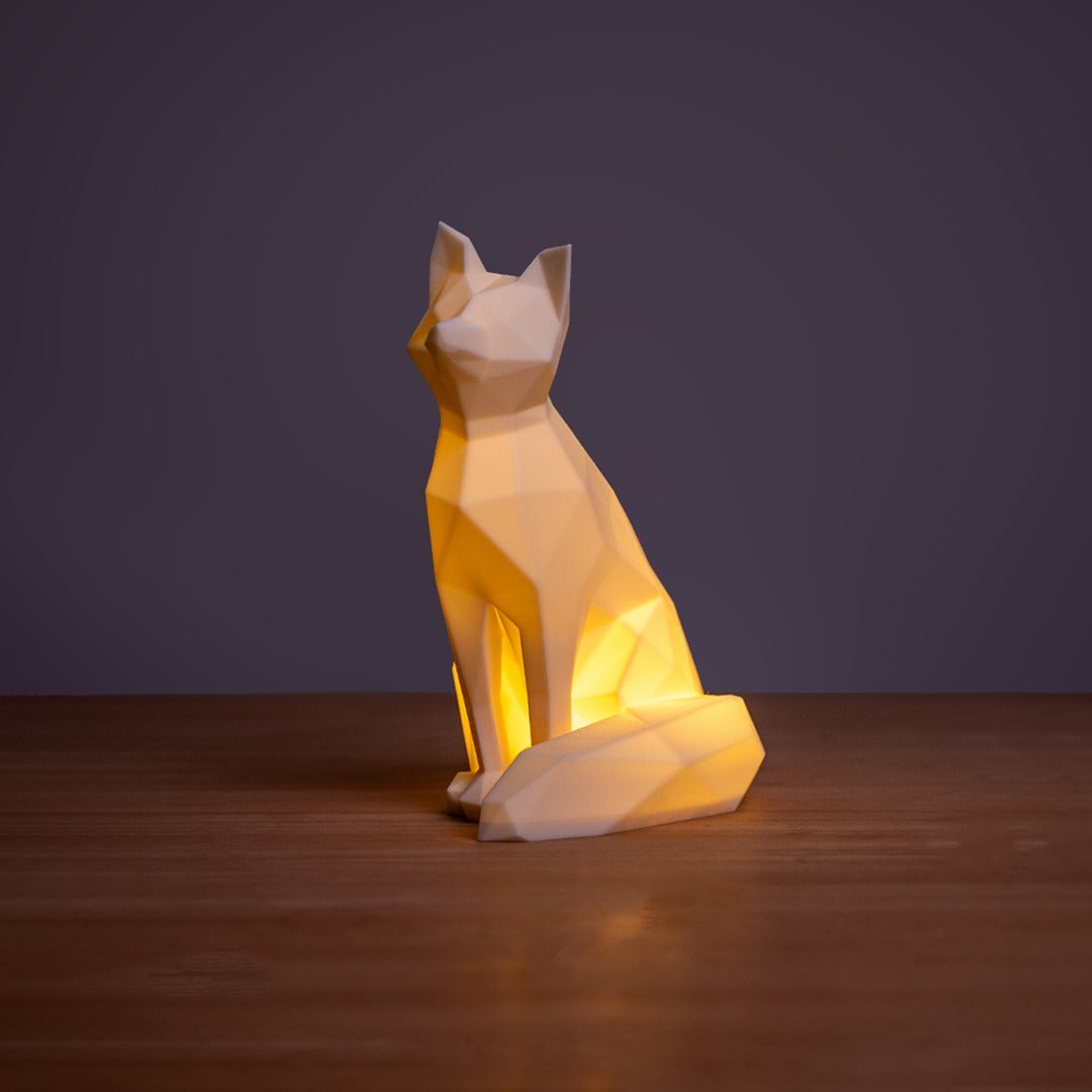 Geometric Fox LED Lamp — lit, three-quarter view with curled tail