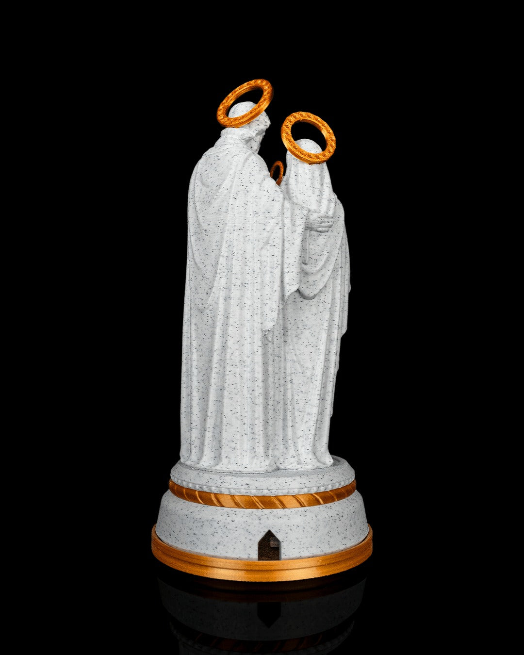 Holy Family Statue — back view showing the cable port