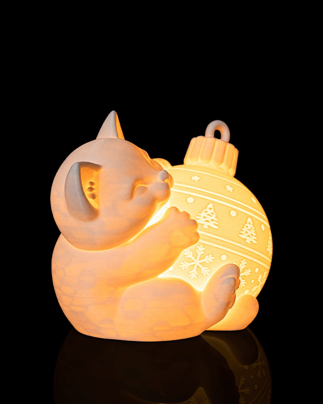Kitten Ornament Table Lamp — lit, three-quarter view