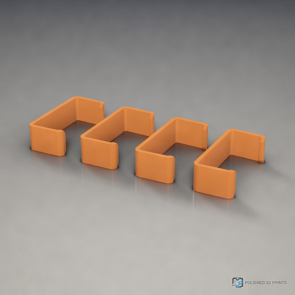 Link-A-Link Cable Management Clips – in PETG Orange on a dark studio background