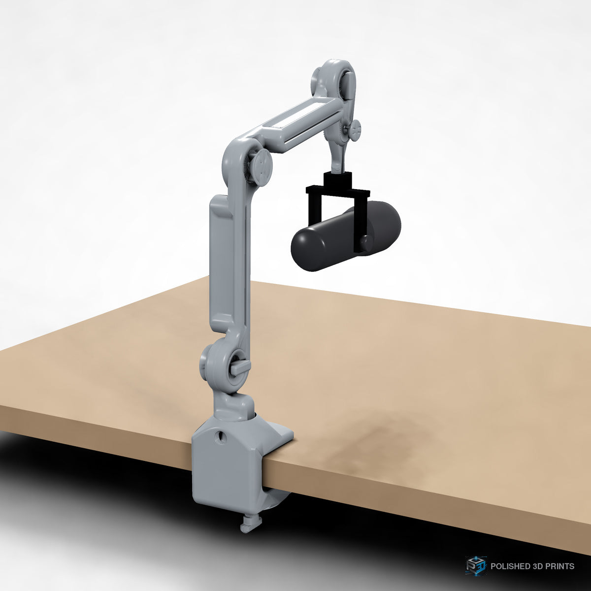 Link-A-Link Mic Arm Kit, assembled clamped to a desk holding a microphone – close-up of the base clamp