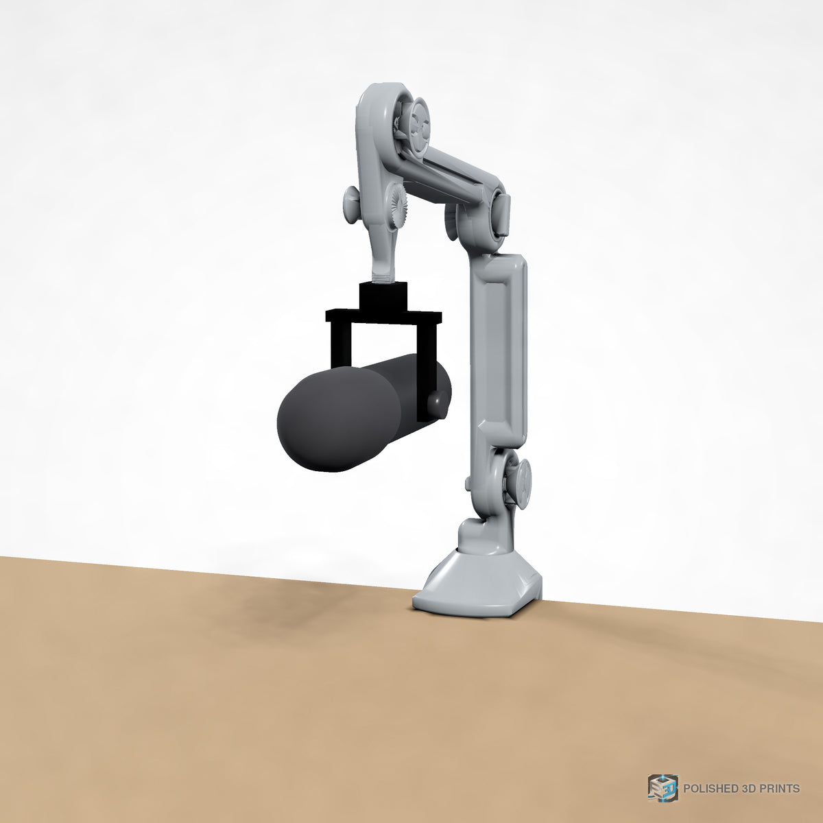 Link-A-Link Mic Arm Kit, assembled clamped to a desk holding a microphone – front view