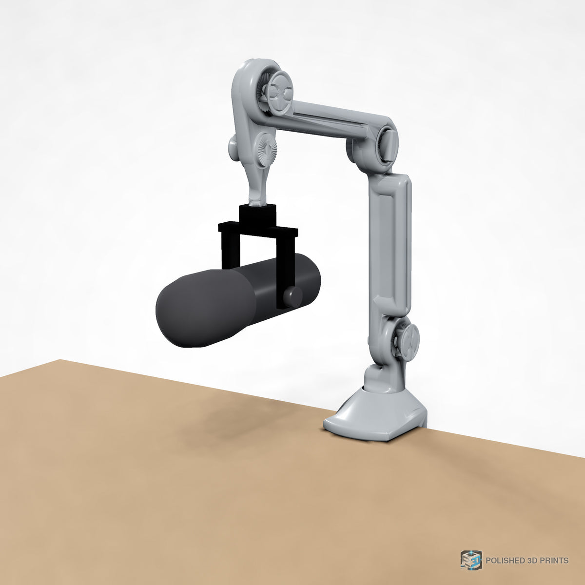 Link-A-Link Mic Arm Kit, assembled clamped to a desk holding a microphone – three-quarter view