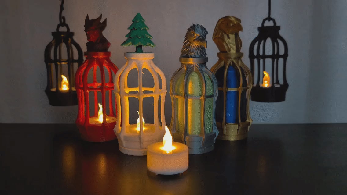 Gothic Tealight Lantern — six lanterns with devil, tree, crow and Horus toppers and hanging chains, glowing with flickering tealights