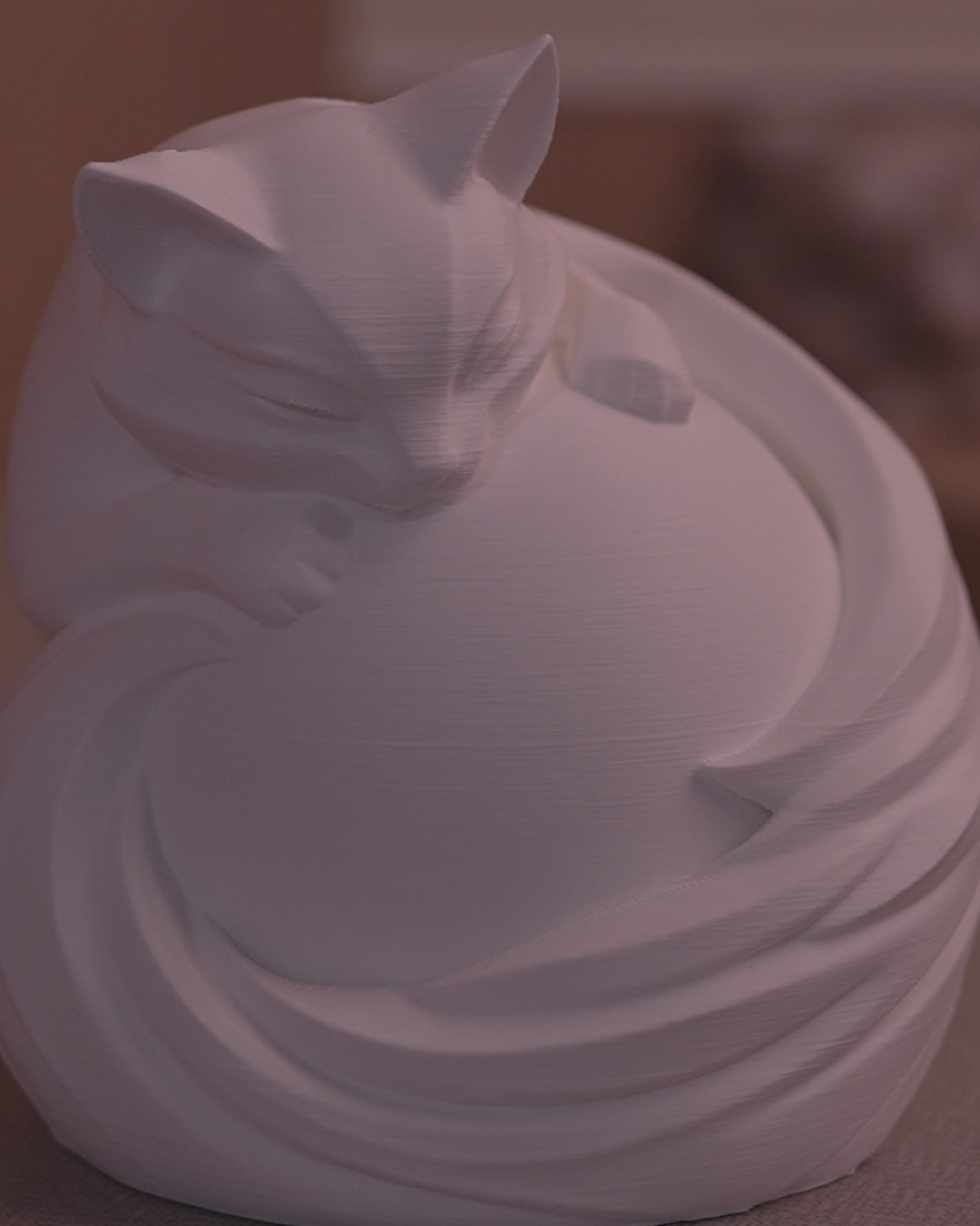 Feline Sphere Table Lamp in motion — 3D-printed cat sphere lamp glowing