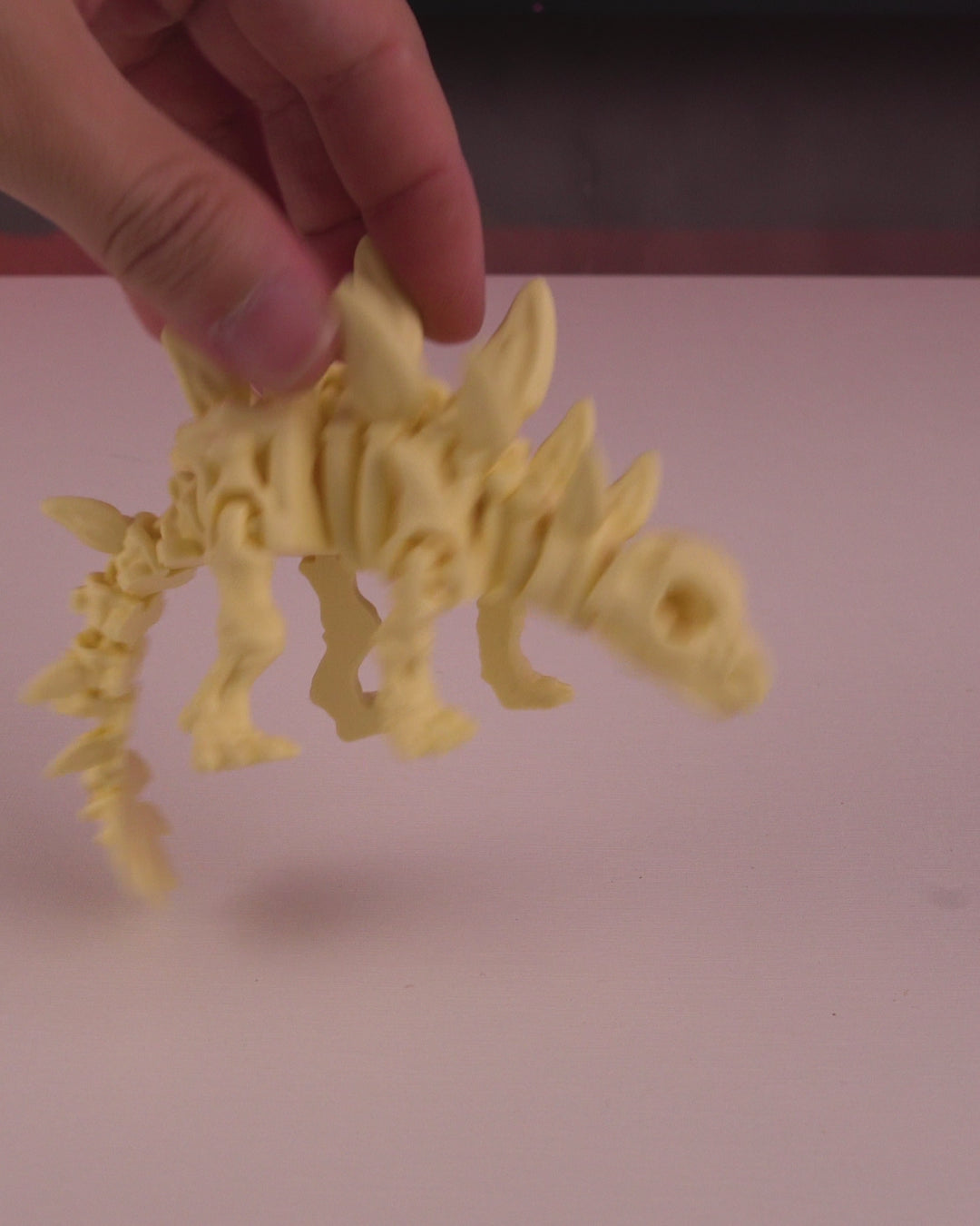 Stegosaurus skeleton articulated 3D print in motion — poseable dinosaur figurine flexing