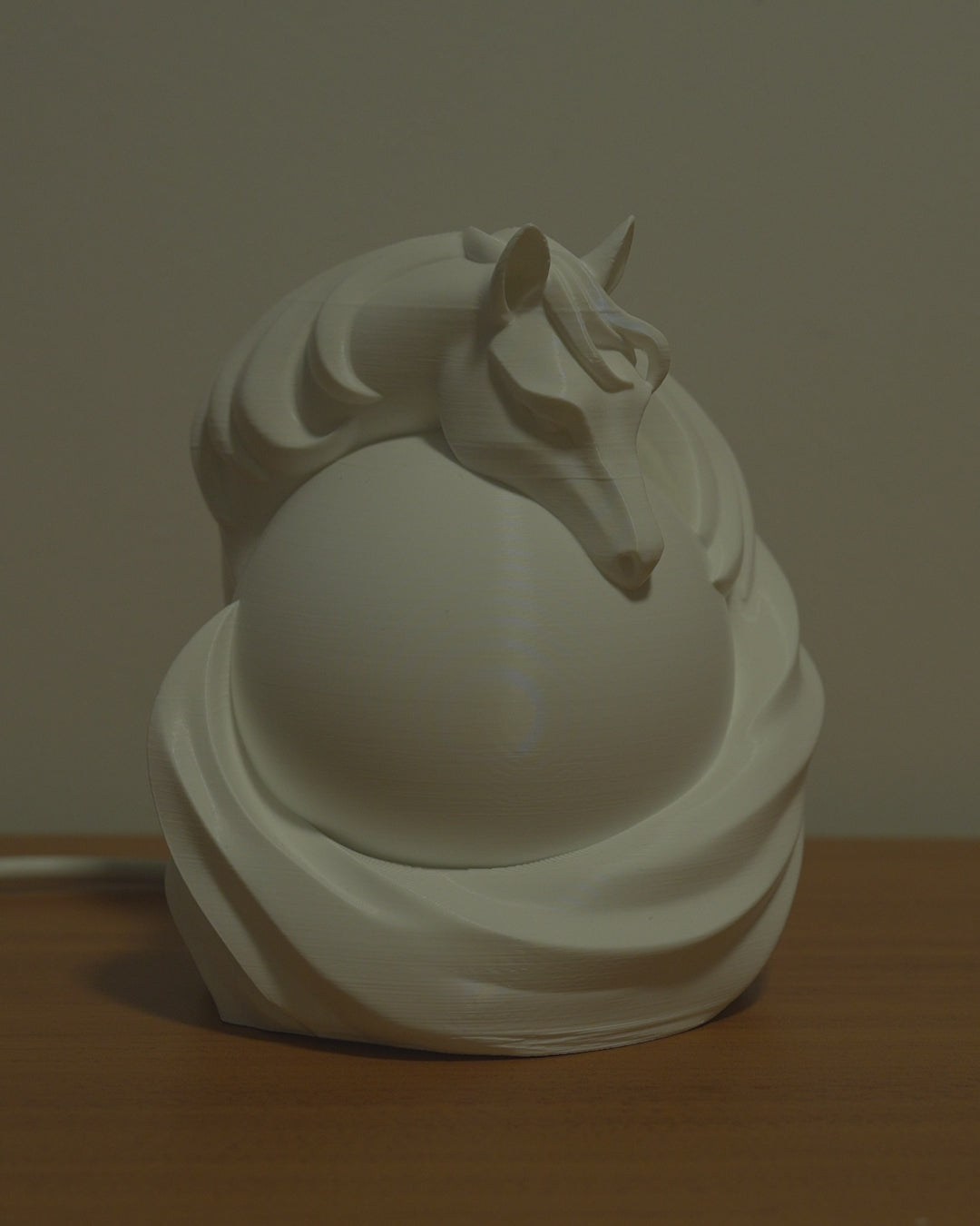Stallion Sphere Table Lamp in motion — 3D-printed horse sphere lamp glowing