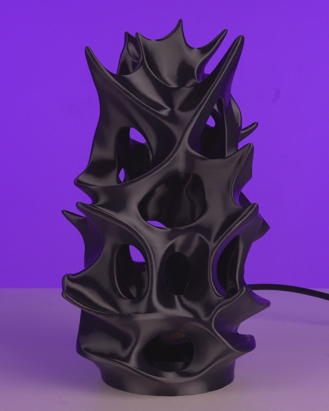 Living Core Table Lamp in motion — sculptural 3D-printed ambient table lamp glowing