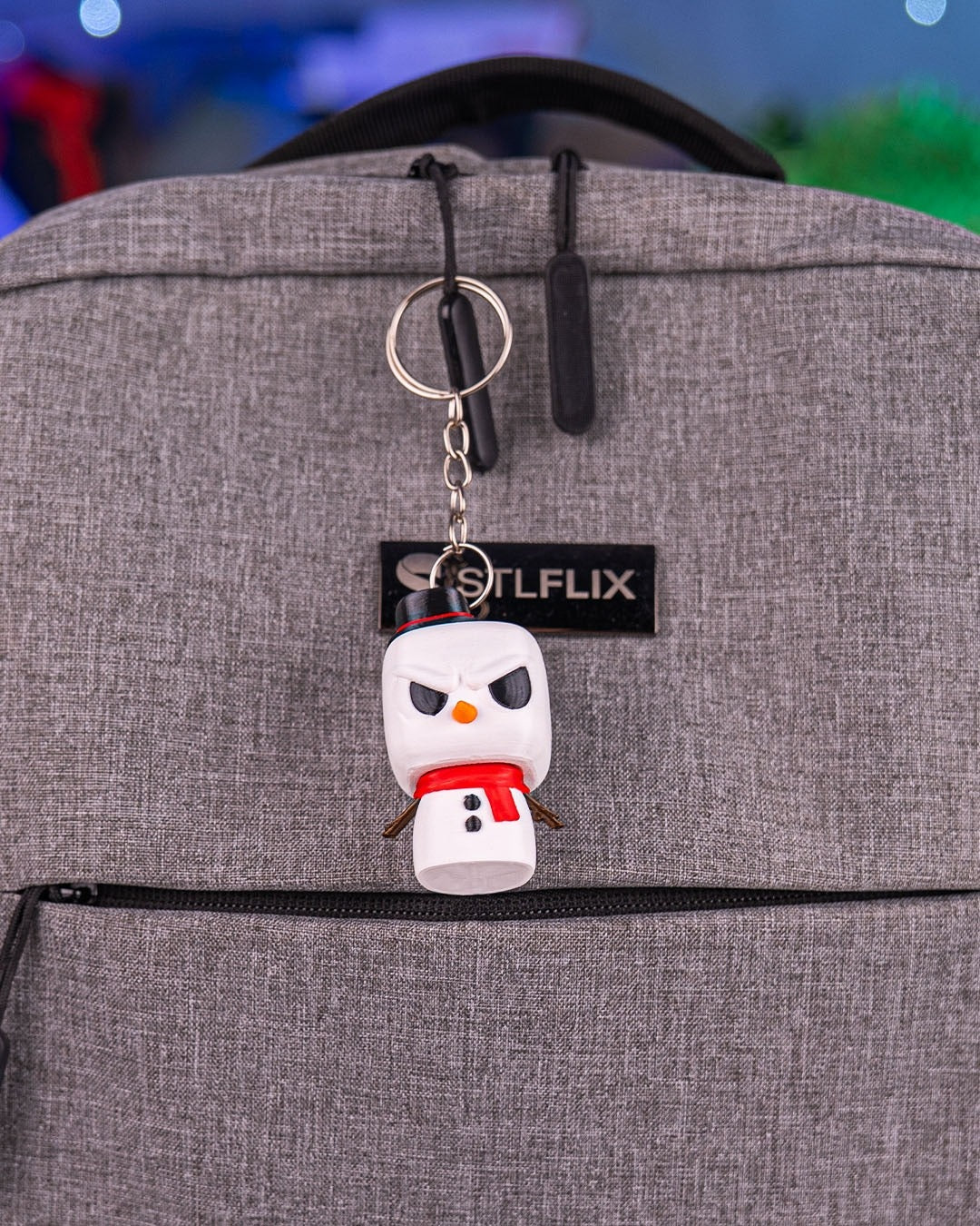 Snowmanty 3D-printed Christmas keyring — clipped to a backpack as a keyring
