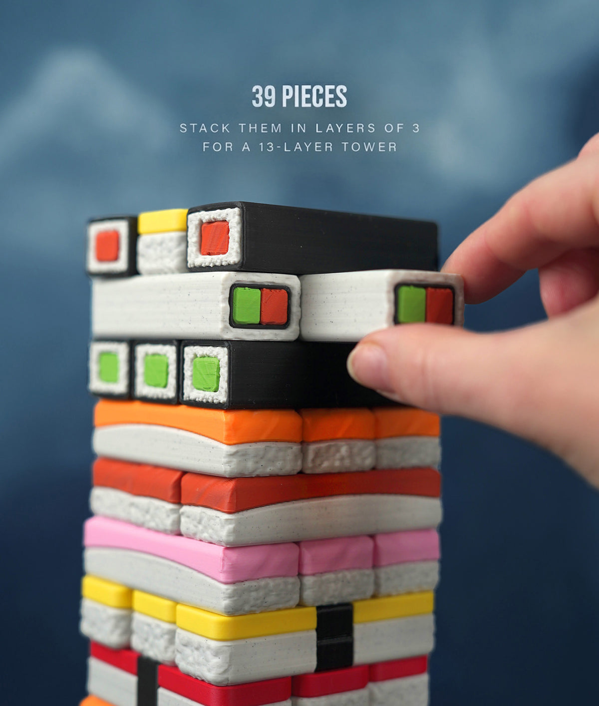 Sushi Stack Tumble Tower Game — pulling a stone from the 39-piece tower