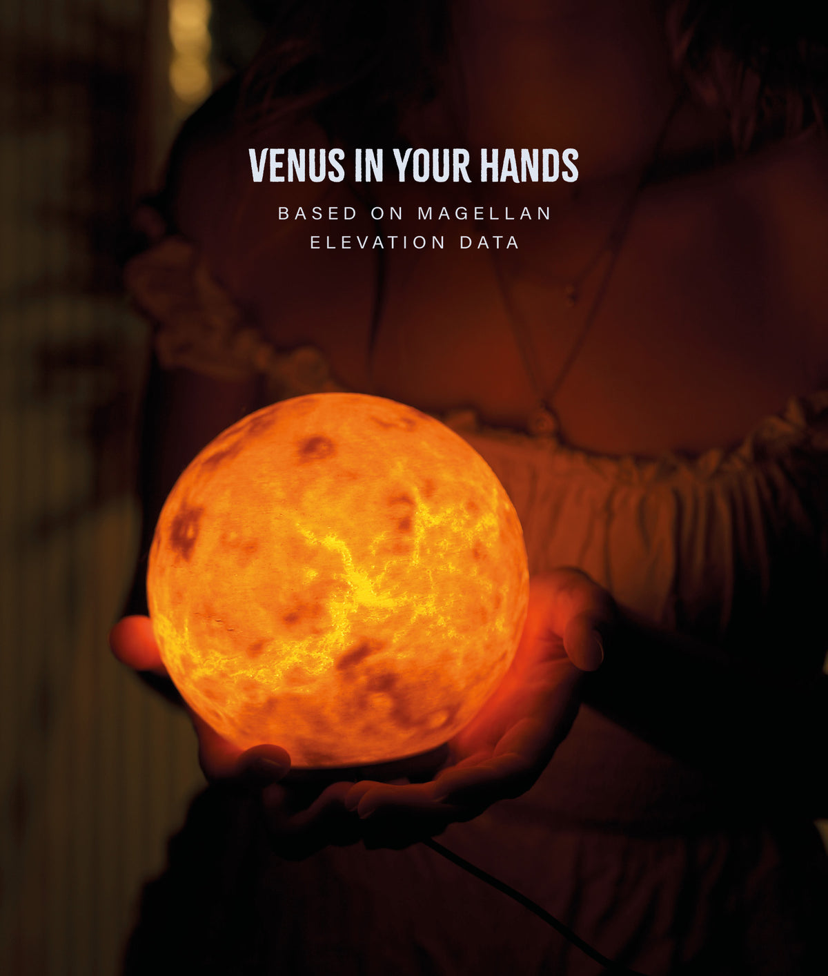 Venus Planet Lamp — glowing globe held in two hands