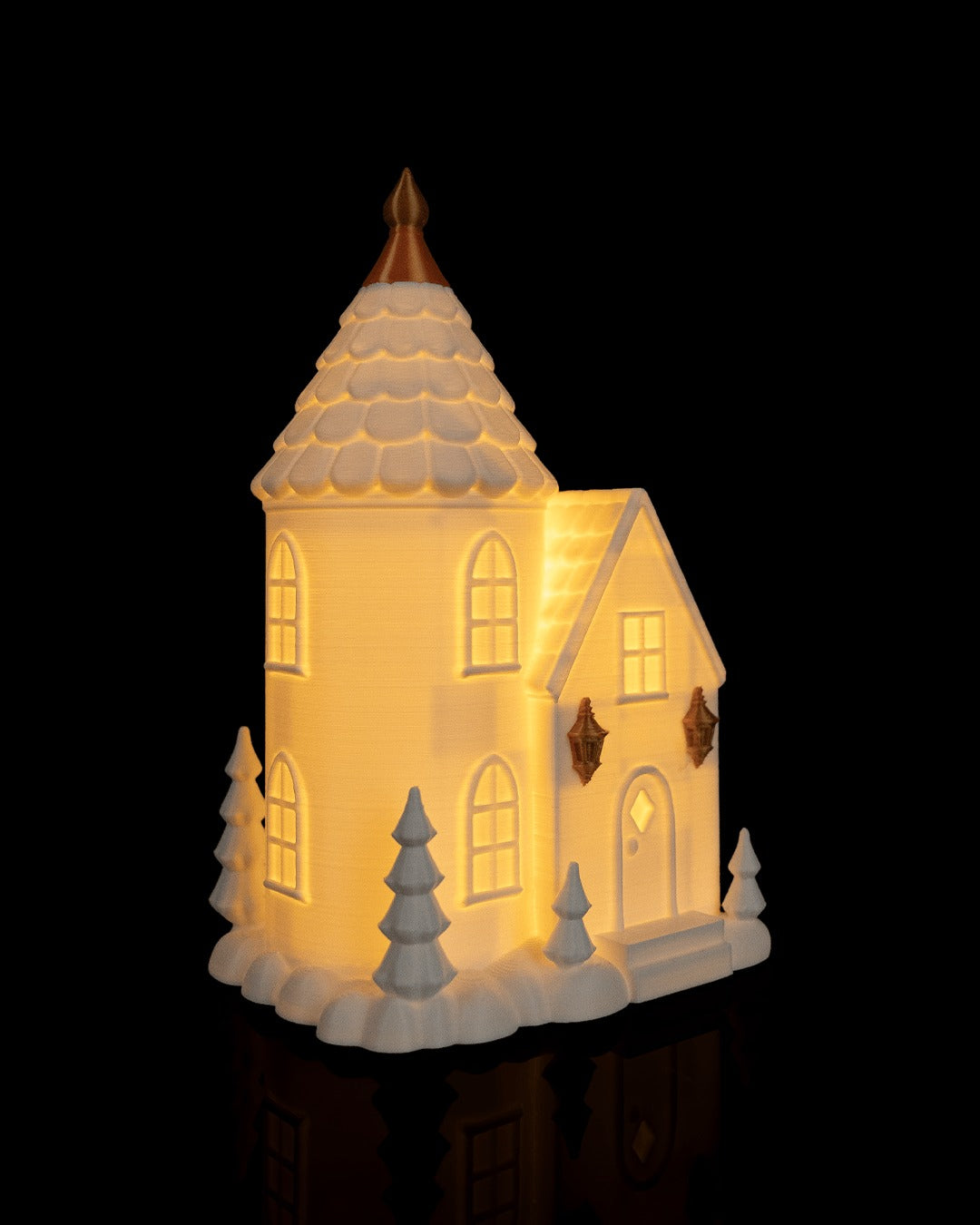 Village Lights Table Lamp — Tower House glowing, three-quarter view